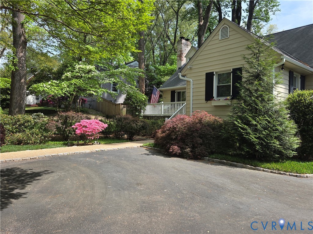7733 Rock Creek Road Henrico, VA 23229 - Photo 2 of 73 a view of a house with a yard and garage