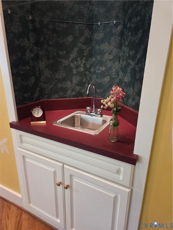 7733 Rock Creek Road Henrico, VA 23229 - Photo 21 of 73 a bathroom with a sink and a mirror