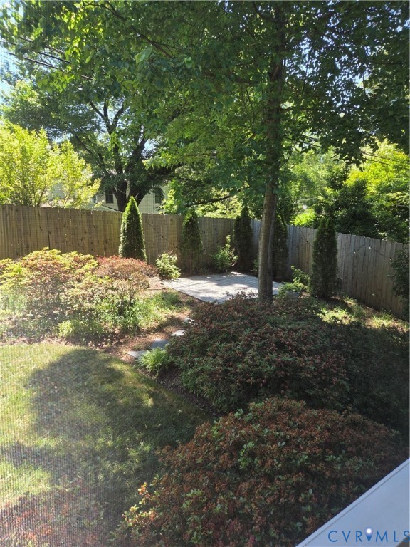 7733 Rock Creek Road Henrico, VA 23229 - Photo 40 of 73 a view of a yard with plants and trees