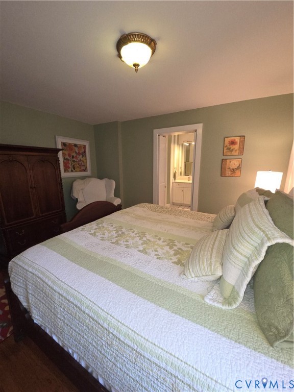7733 Rock Creek Road Henrico, VA 23229 - Photo 43 of 73 a bedroom with a bed and a lamp
