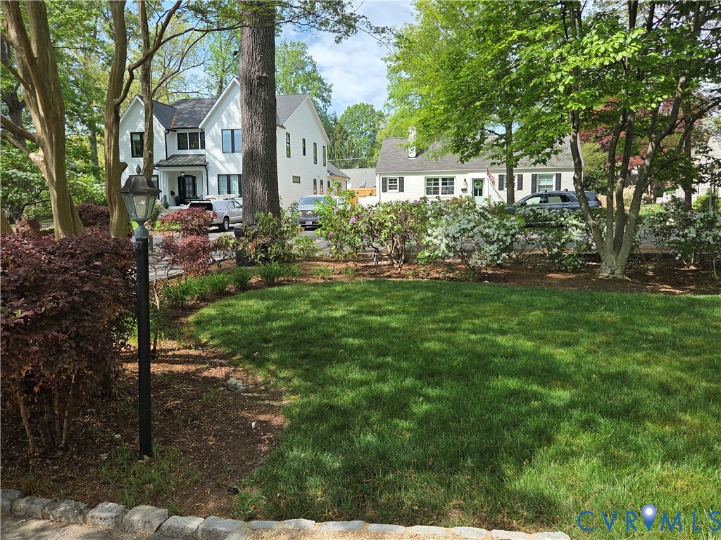 7733 Rock Creek Road Henrico, VA 23229 - Photo 5 of 73 a front view of a house with a yard