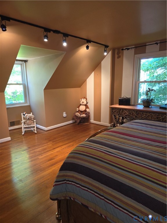 7733 Rock Creek Road Henrico, VA 23229 - Photo 55 of 73 a bedroom with wooden floor and windows