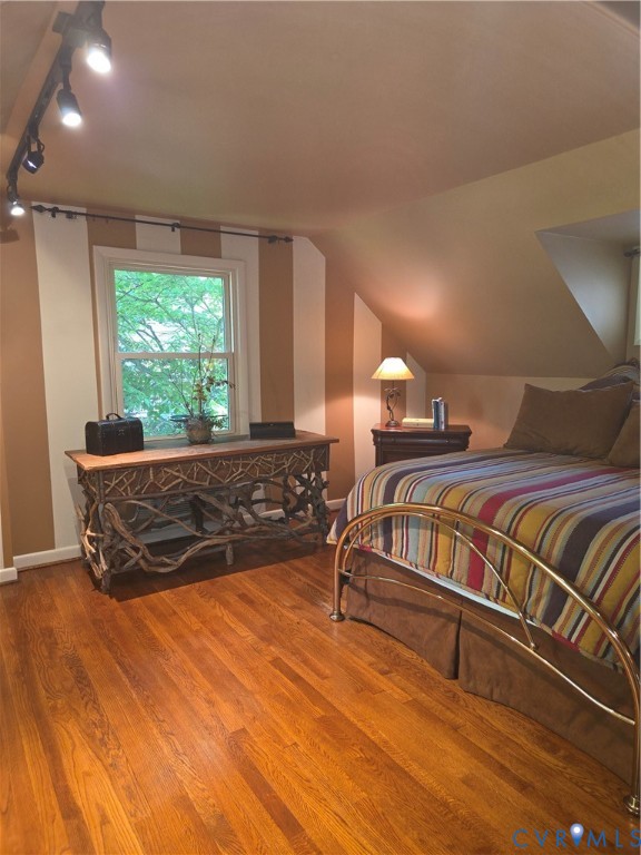 7733 Rock Creek Road Henrico, VA 23229 - Photo 56 of 73 a bed sitting in a bedroom next to a window