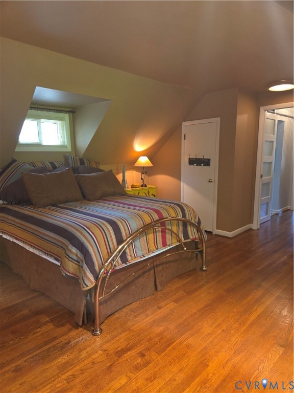 7733 Rock Creek Road Henrico, VA 23229 - Photo 57 of 73 a bedroom with a bed and a mirror