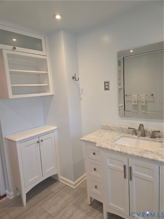 7733 Rock Creek Road Henrico, VA 23229 - Photo 59 of 73 a bathroom with a sink and a mirror