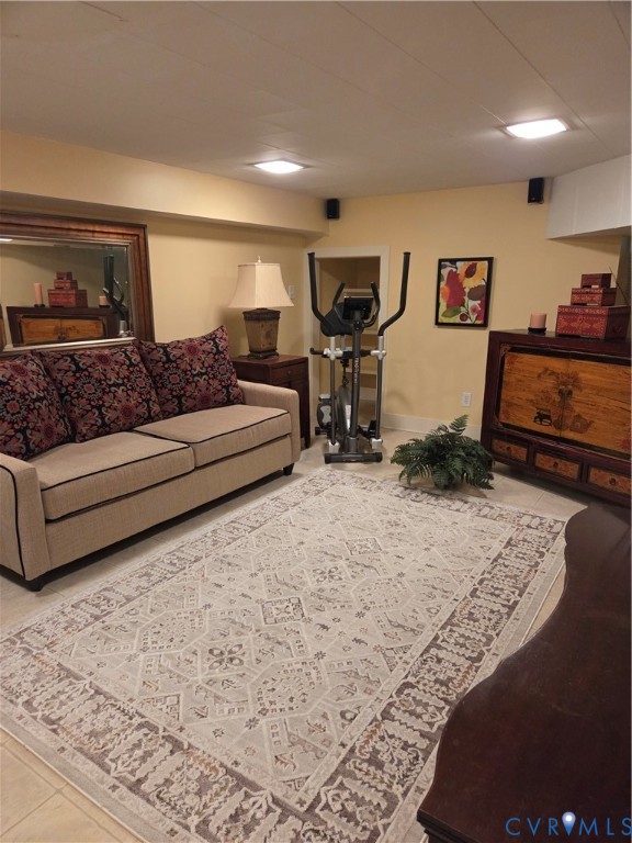 7733 Rock Creek Road Henrico, VA 23229 - Photo 64 of 73 a living room with furniture flat screen tv and a lamp