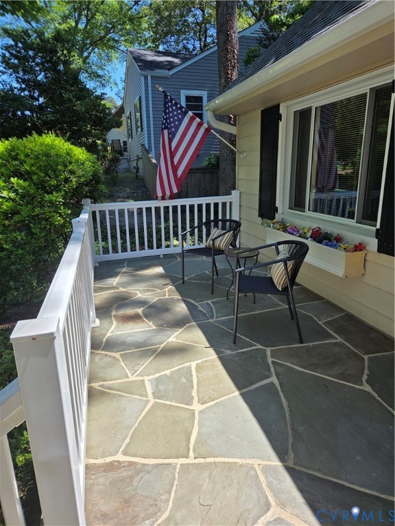 7733 Rock Creek Road Henrico, VA 23229 - Photo 8 of 73 a view of a chairs and table in the patio