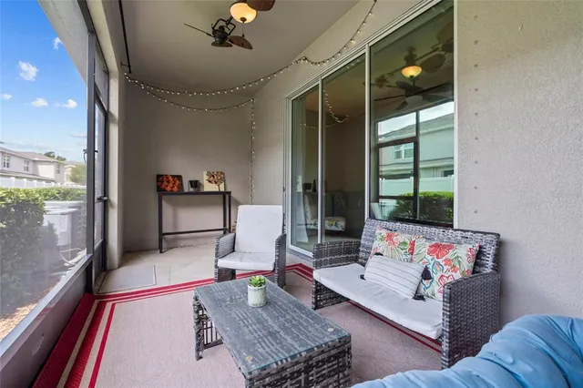 a living room with furniture rug and a large window