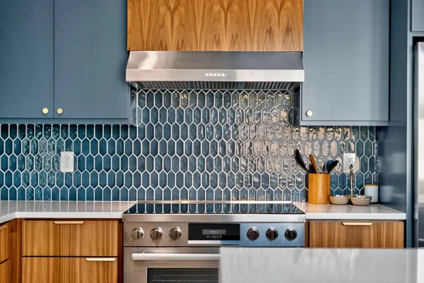 a kitchen with a window and cabinets