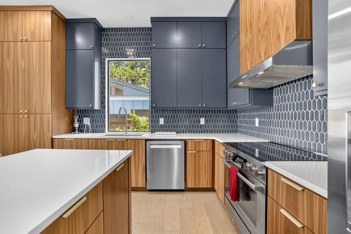 2316 Euclid Avenue Austin, TX 78704 - Photo 16 of 40 a kitchen with stainless steel appliances granite countertop a sink and a stove