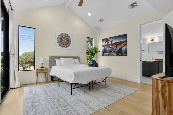 a living room with furniture a rug and a window