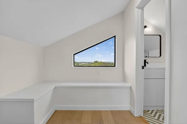 a view of a two chair and tables in the balcony