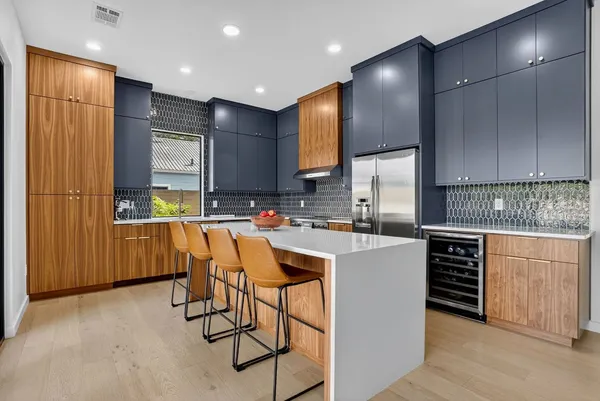 a kitchen with counter top space cabinets and stainless steel appliances