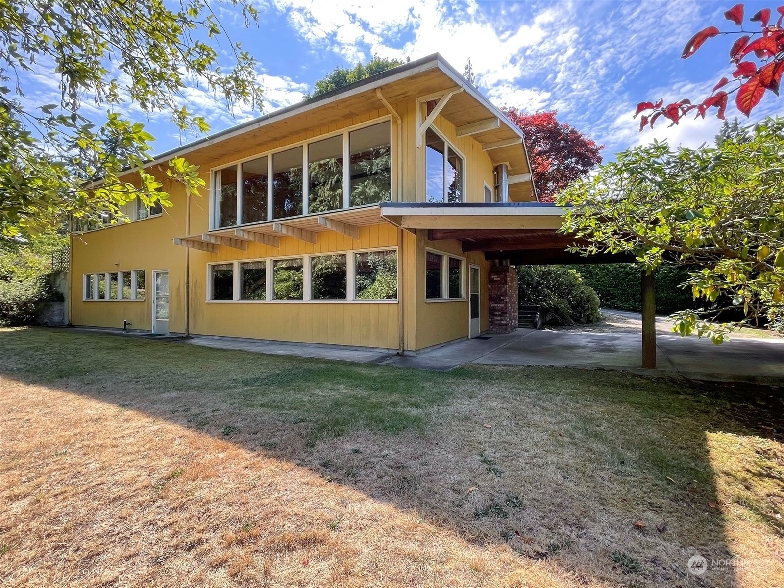 4217 South Bean Road Port Angeles, WA 98363 - Photo 1 of 40 a view of a house with a garden and pathway
