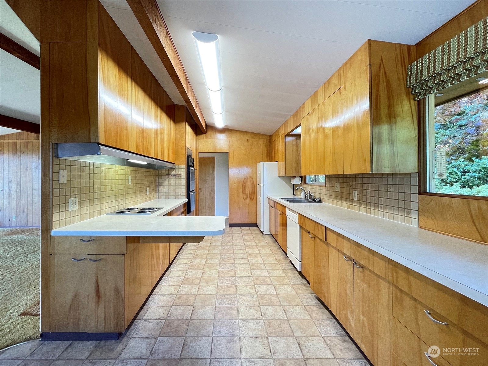 4217 South Bean Road Port Angeles, WA 98363 - Photo 11 of 40 a large kitchen with a large counter top and stainless steel appliances