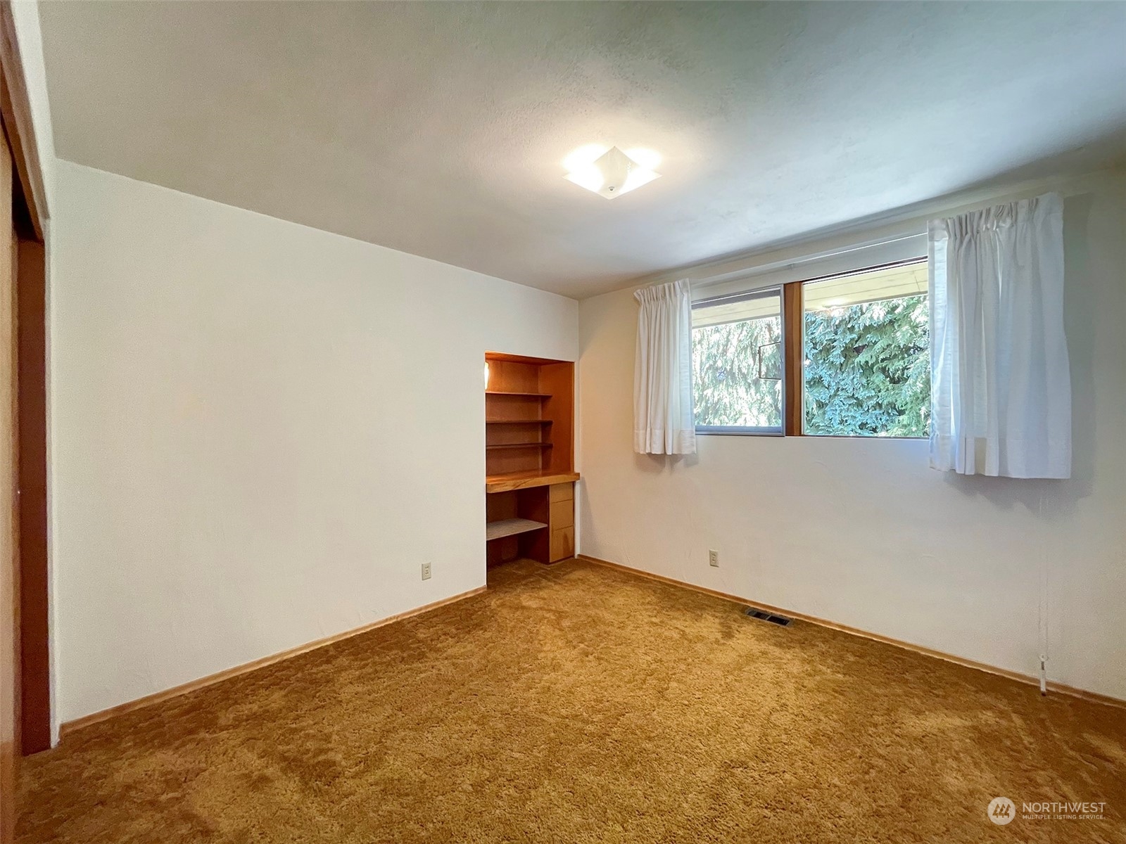 4217 South Bean Road Port Angeles, WA 98363 - Photo 16 of 40 an empty room with windows