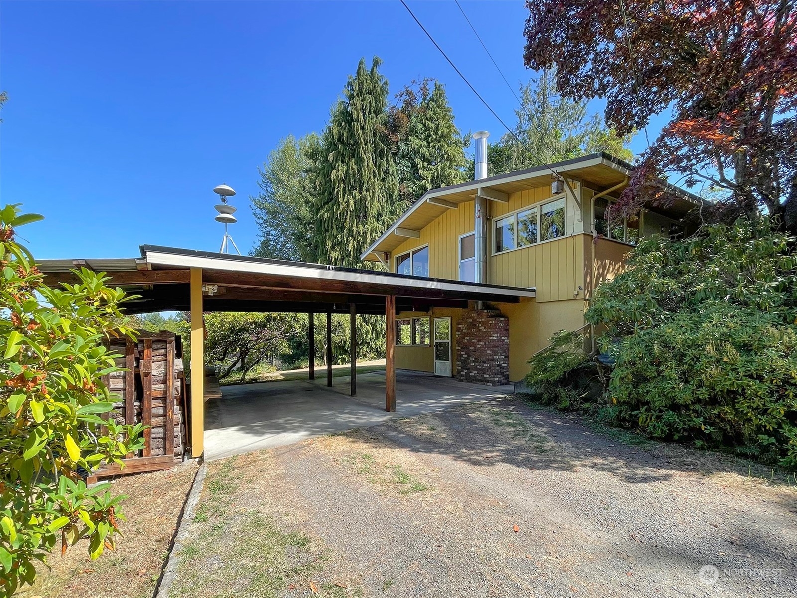4217 South Bean Road Port Angeles, WA 98363 - Photo 2 of 40 a view of a chair and table in the backyard