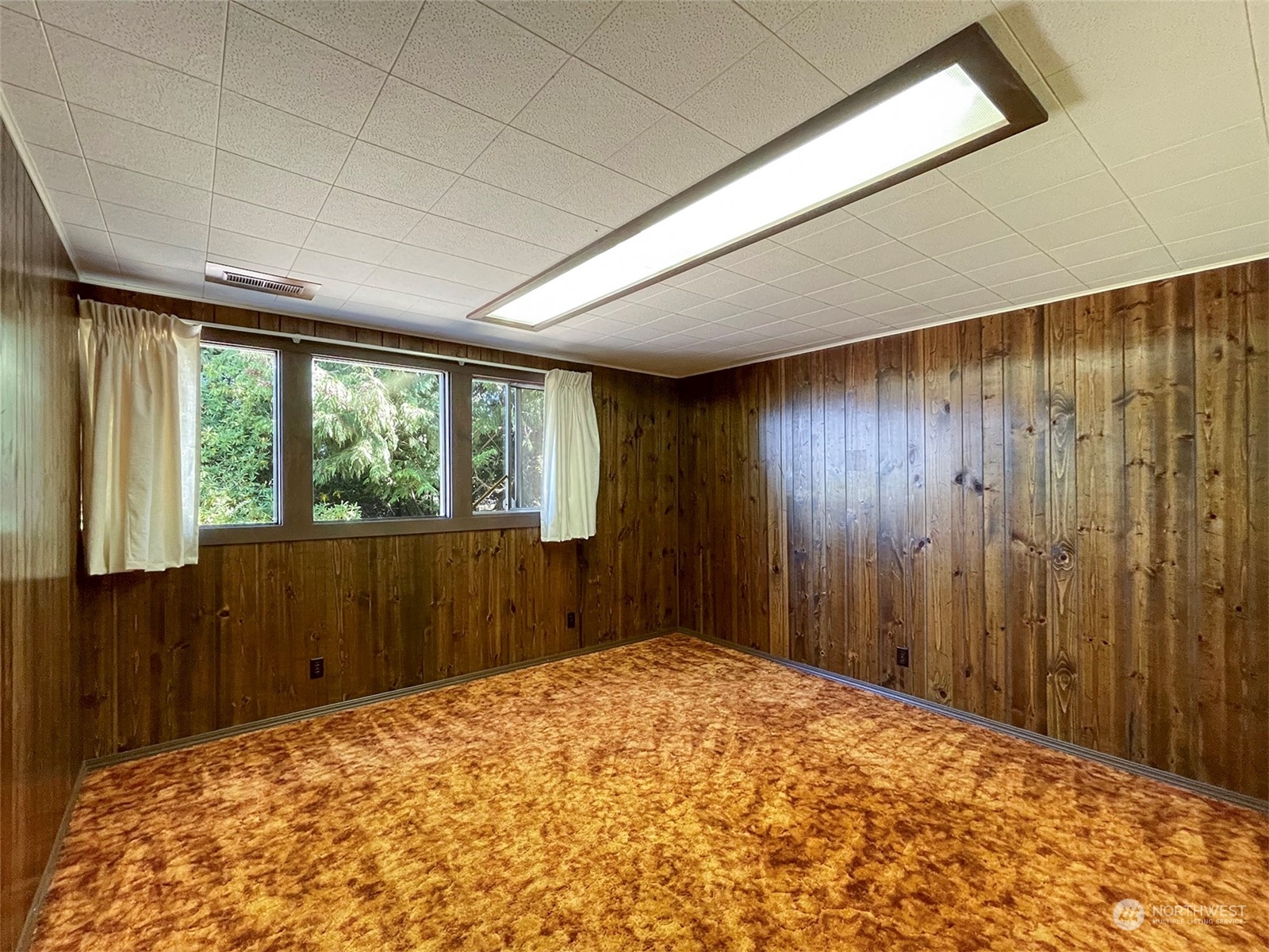 4217 South Bean Road Port Angeles, WA 98363 - Photo 28 of 40 a view of a big room with a large window and doors
