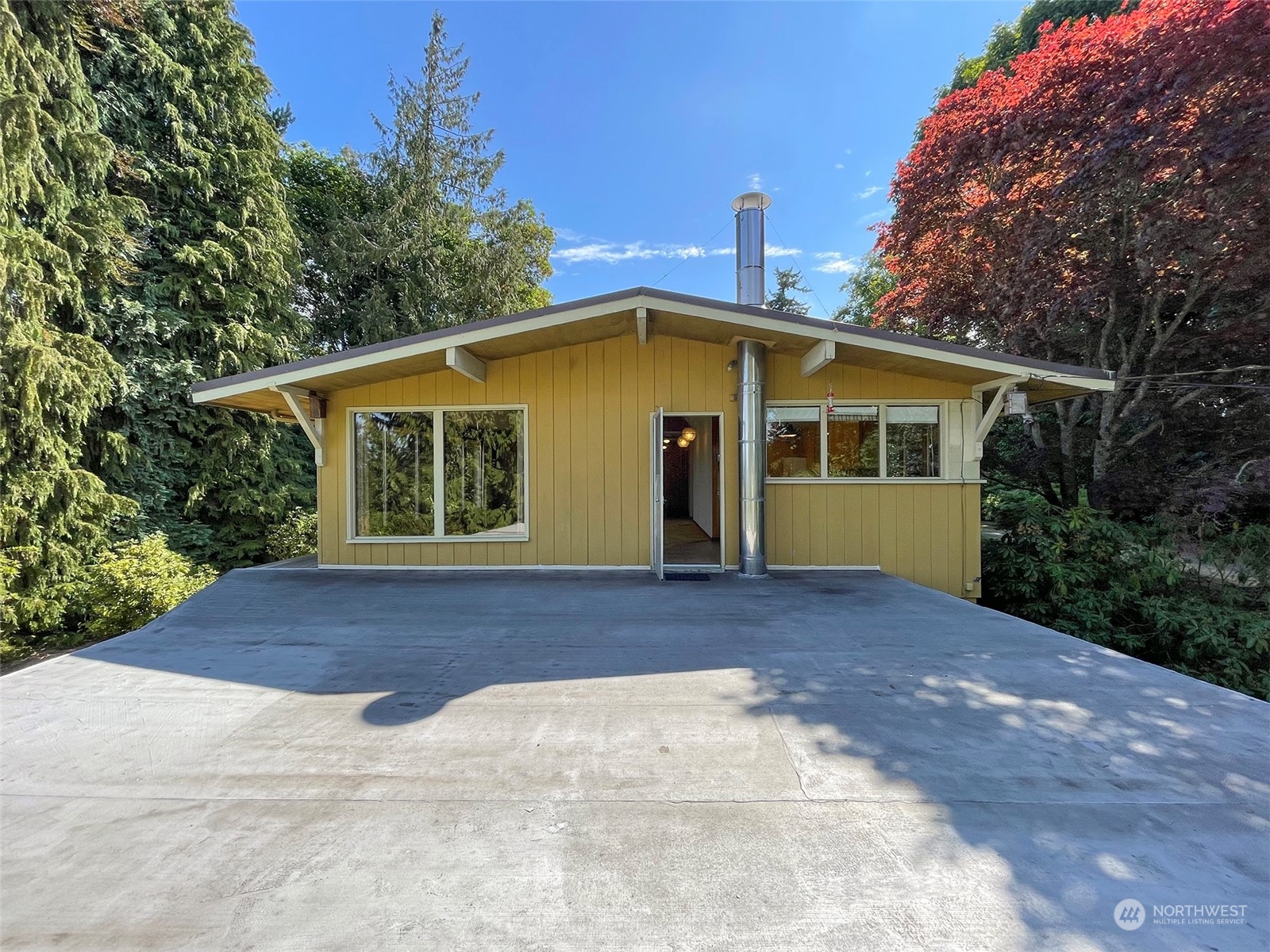 4217 South Bean Road Port Angeles, WA 98363 - Photo 7 of 40 a front view of a house with a garden