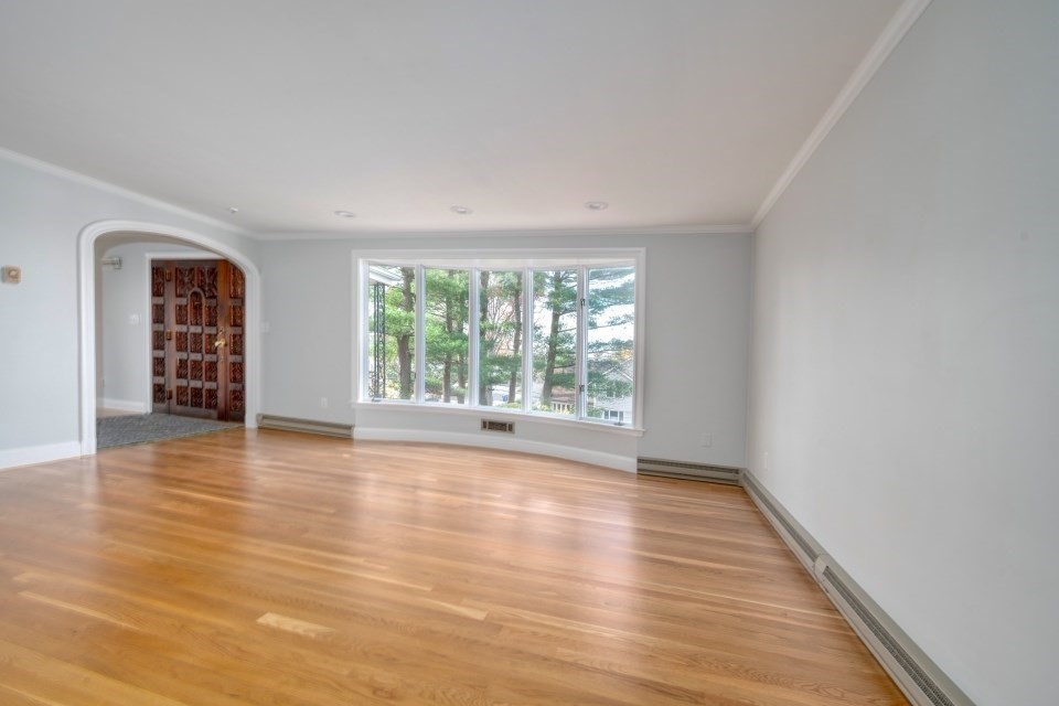 48 Conrad Street Braintree, MA 02184 - Photo 17 of 36 a view of an empty room with wooden floor and a window