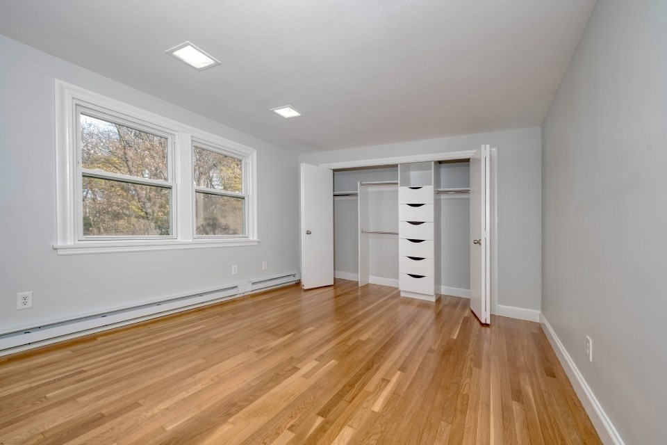 48 Conrad Street Braintree, MA 02184 - Photo 21 of 36 a view of a room with wooden floor and window