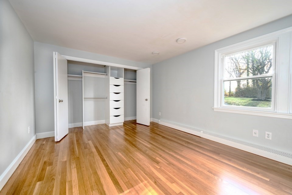 48 Conrad Street Braintree, MA 02184 - Photo 22 of 36 a view of empty room with wooden floor and fan