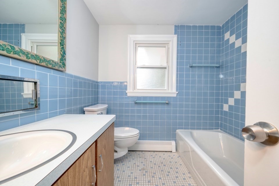 48 Conrad Street Braintree, MA 02184 - Photo 27 of 36 a bathroom with a sink a bathtub and toilet