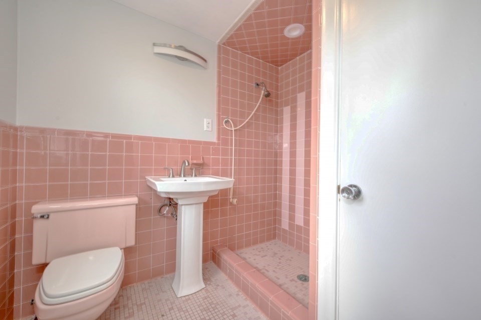 48 Conrad Street Braintree, MA 02184 - Photo 28 of 36 a white toilet sitting next to a bathroom sink