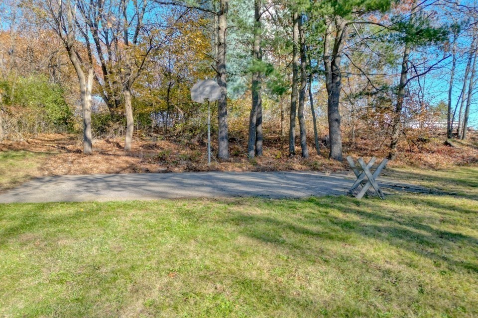 48 Conrad Street Braintree, MA 02184 - Photo 33 of 36 a backyard of a house with lots of green space
