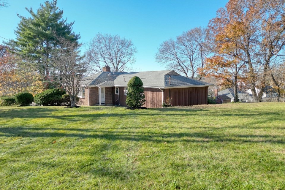 48 Conrad Street Braintree, MA 02184 - Photo 6 of 36 a front view of house with yard outdoor seating and green space