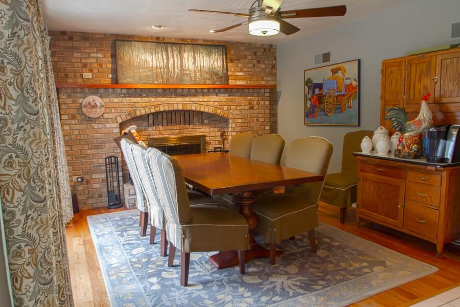447 Dinnerbell Road Butler, PA 16002 - Photo 8 of 25 This Dining area features beautiful hardwood floors and an open hearth fireplace.