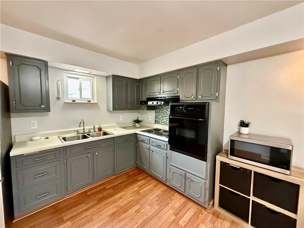 605 Fleming Road Sarver, PA 16055 - Photo 4 of 46 a kitchen with granite countertop stainless steel appliances cabinets a sink and a window