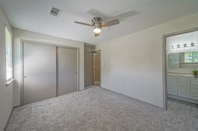 a big room with closet and mirror