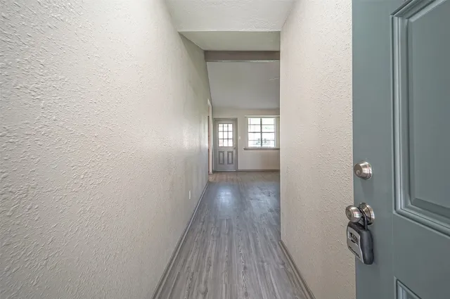 a view of entryway with wooden floor