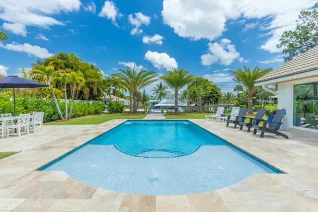a view of a swimming pool with a patio