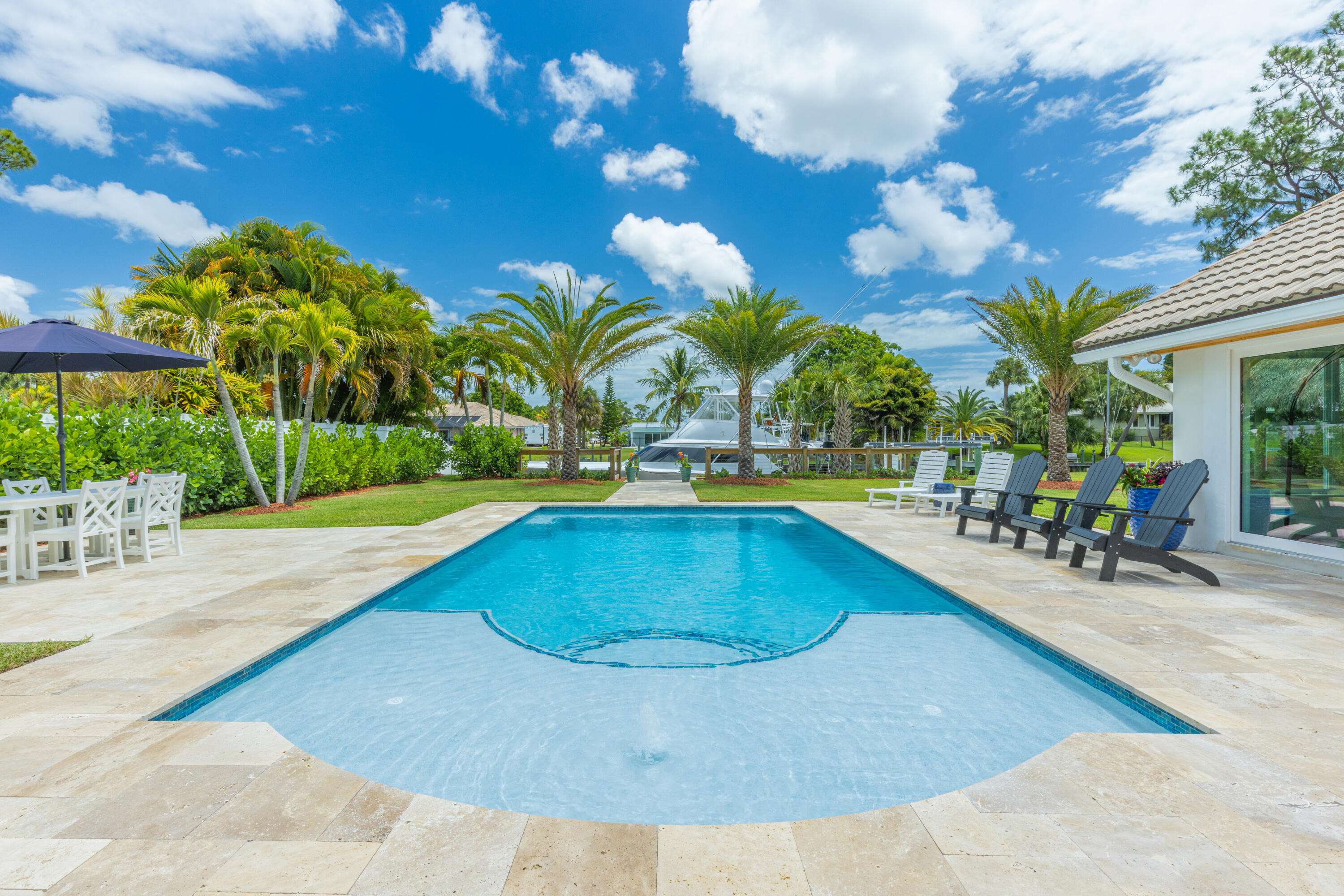 a view of a swimming pool with a patio