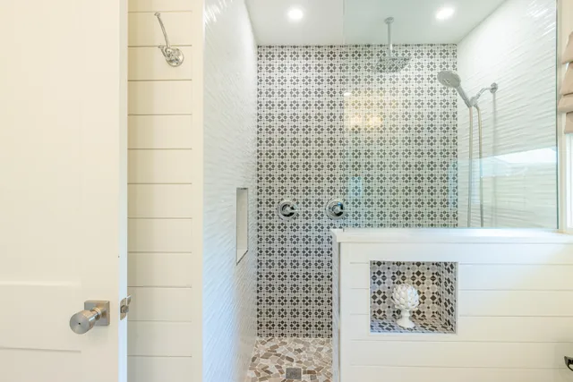 a bathroom with a shower and a shower