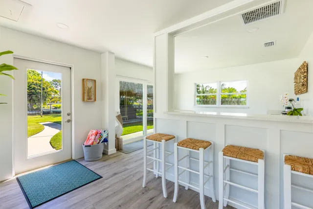 a view of a dining room with furniture and a window