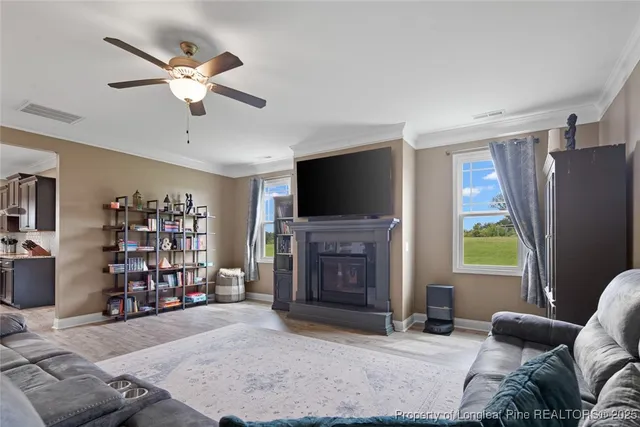 a living room with lots of furniture and a flat screen tv