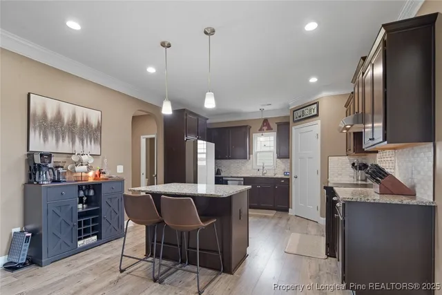 a white refrigerator freezer sitting inside of a kitchen