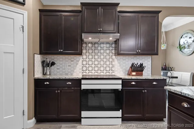 a kitchen with stainless steel appliances a refrigerator and a sink