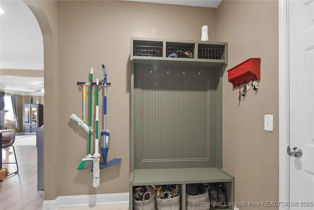 a view of a dining room with furniture and a window