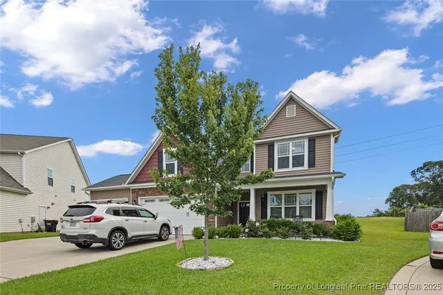 a car parked in front of a house