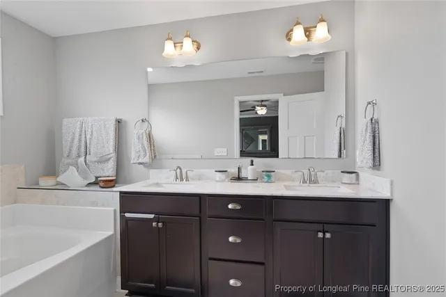a white bath tub sitting next to a window