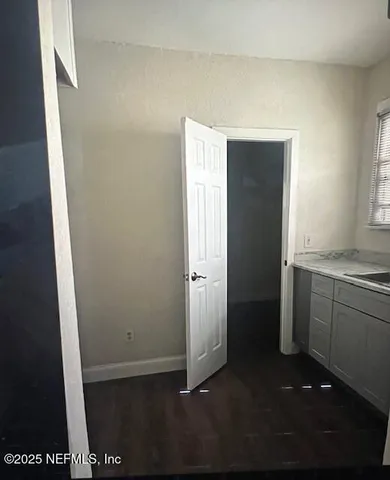 a view of hallway with cabinets