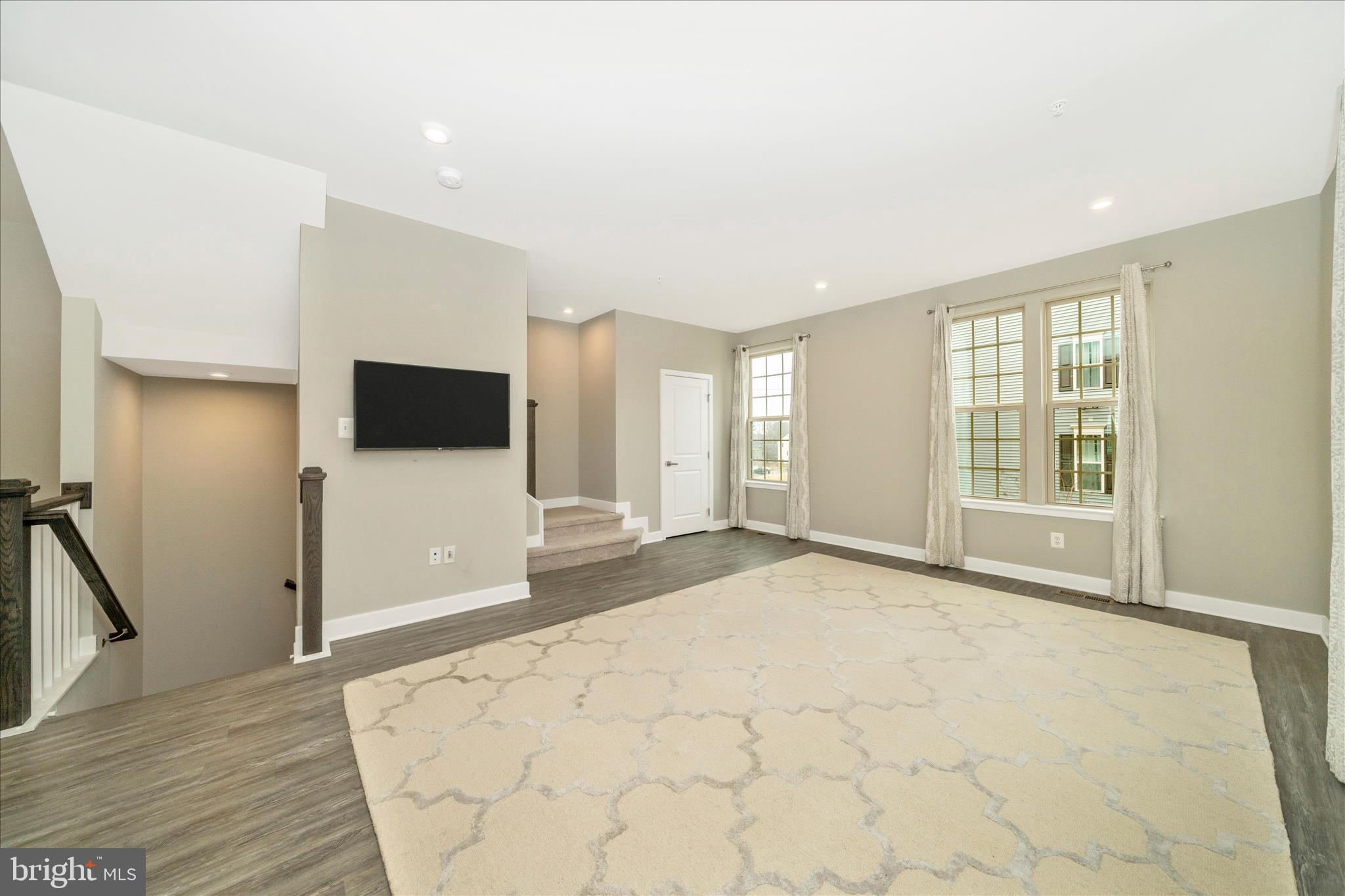 9537 Tall Oaks Road Montgomery Village, MD 20886 - Photo 11 of 53 a view of an empty room with wooden floor and a window