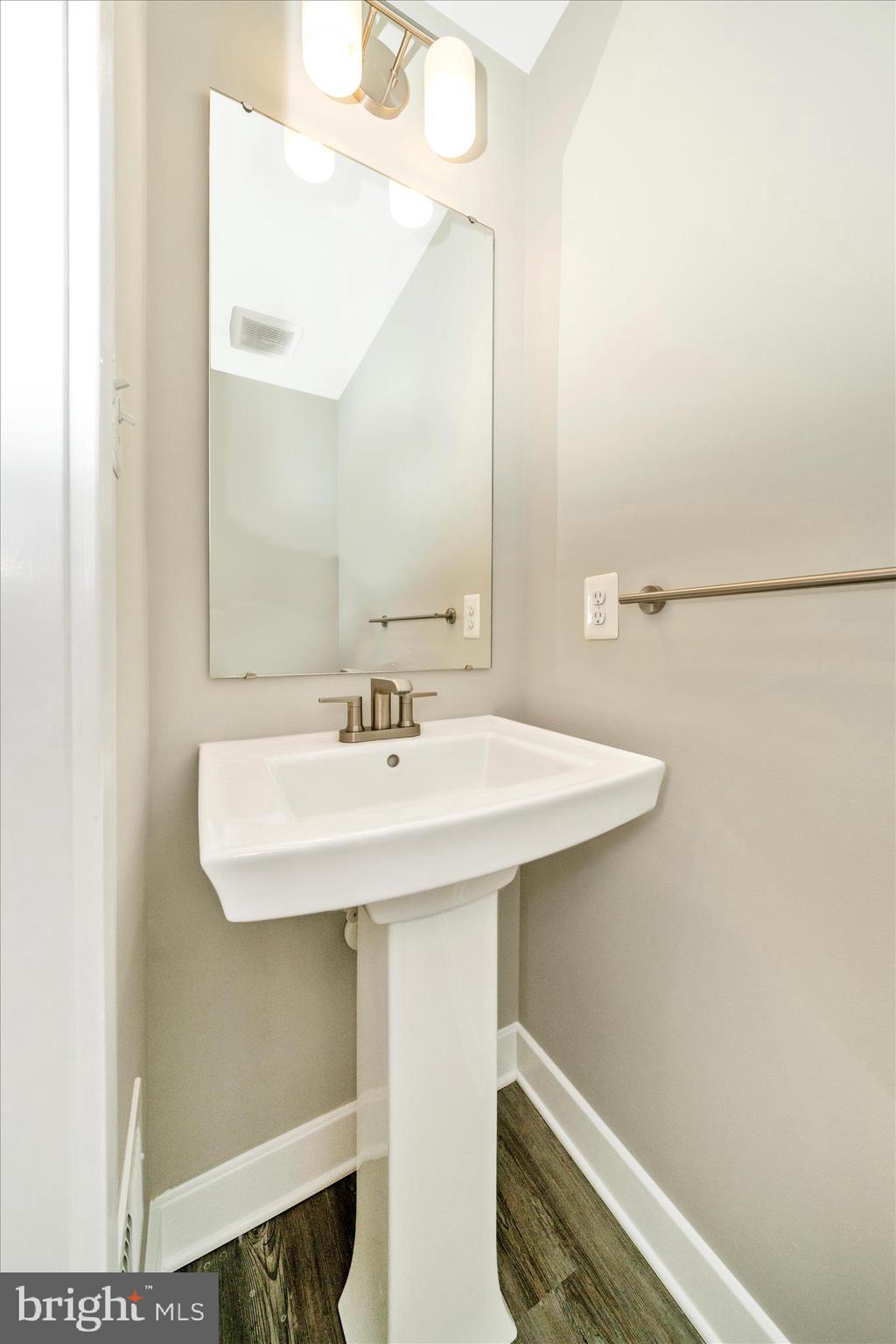 9537 Tall Oaks Road Montgomery Village, MD 20886 - Photo 24 of 53 a bathroom with a sink and a mirror