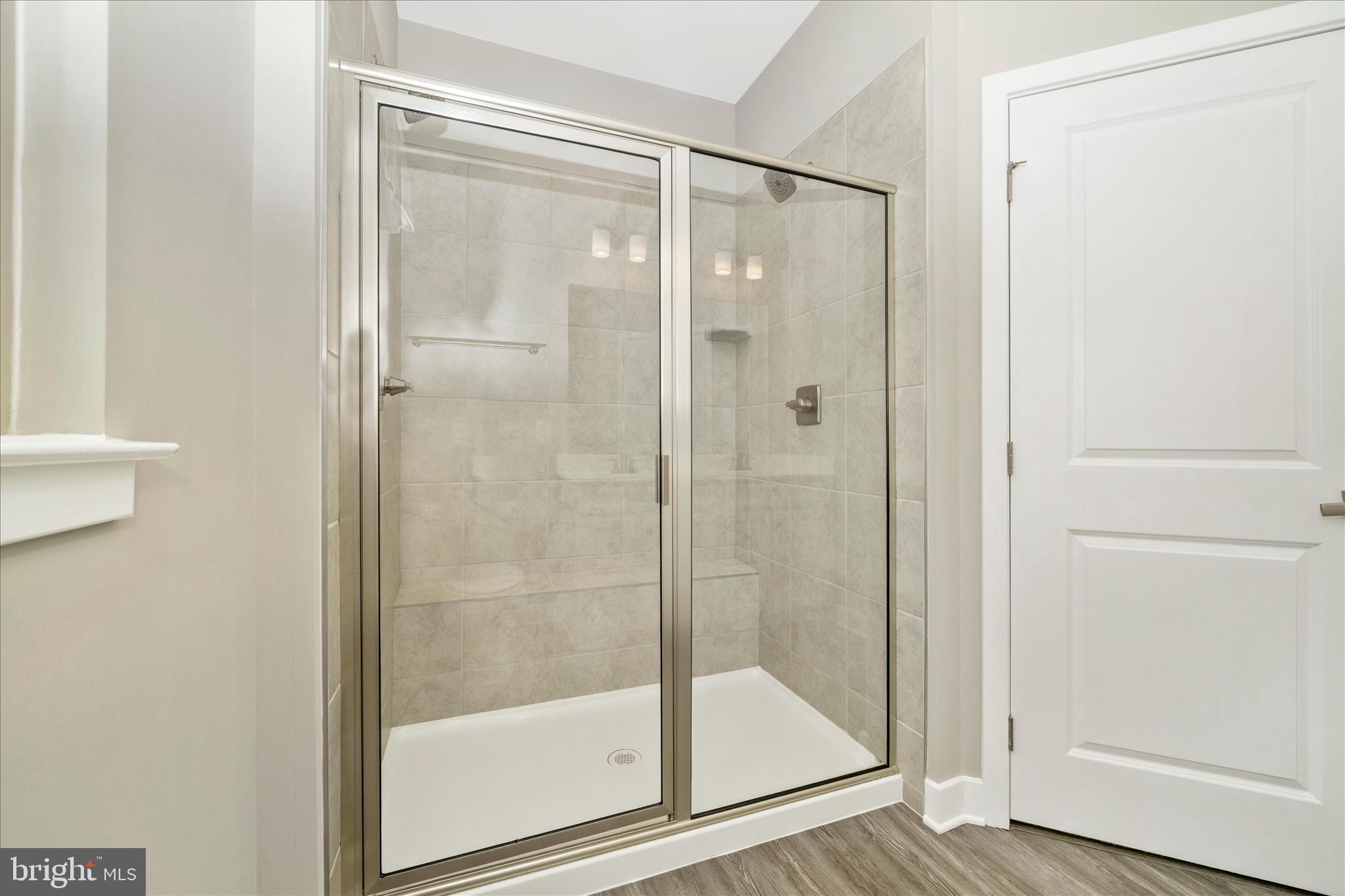 9537 Tall Oaks Road Montgomery Village, MD 20886 - Photo 30 of 53 a bathroom with a glass shower door