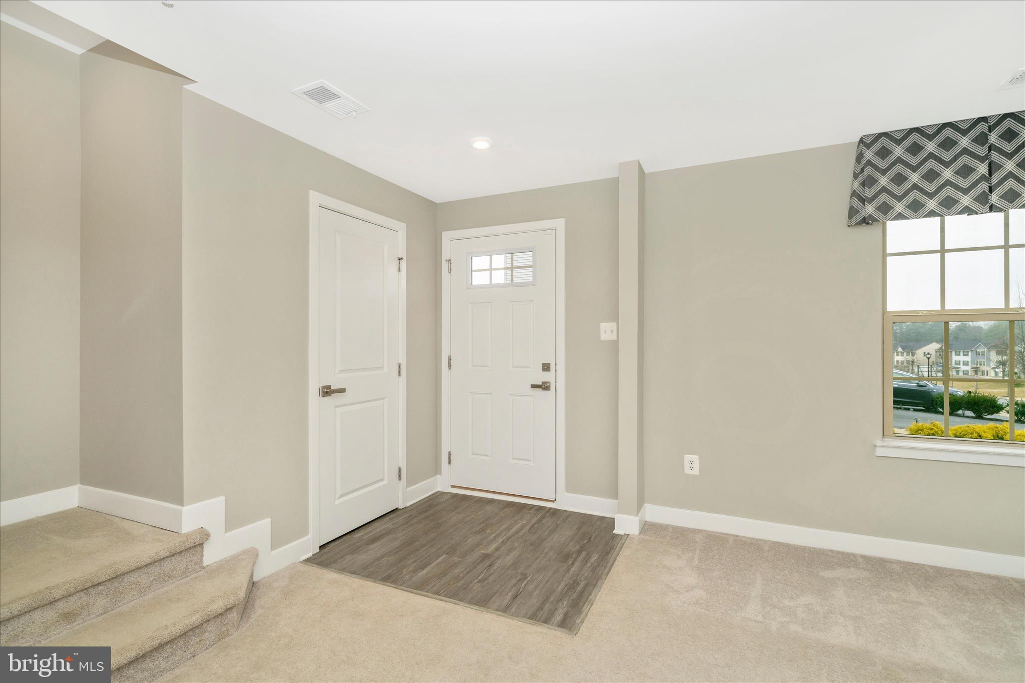 9537 Tall Oaks Road Montgomery Village, MD 20886 - Photo 3 of 53 a view of an empty room and window