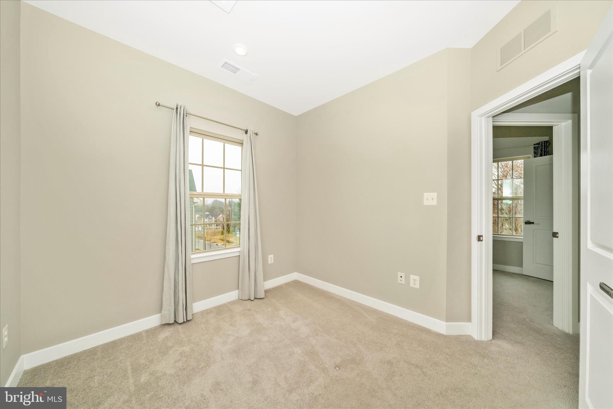 9537 Tall Oaks Road Montgomery Village, MD 20886 - Photo 32 of 53 an empty room with windows